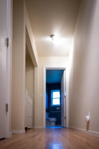 a bathroom with a sink a toilet and a window