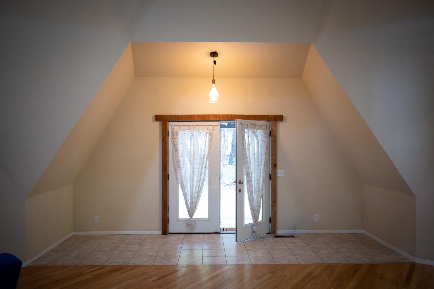 18125 Douglas Road Nevada City, CA 95959 - Photo 31 of 48 an empty room with wooden floor and windows