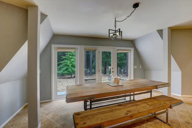 a view of a balcony with chair and table