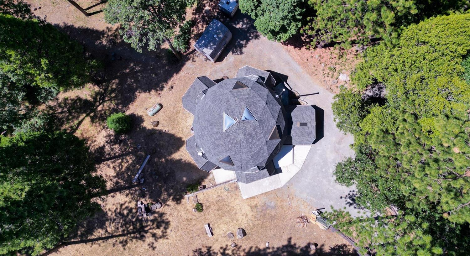 18125 Douglas Road Nevada City, CA 95959 - Photo 44 of 48 an aerial view of a house with a yard and covered with trees