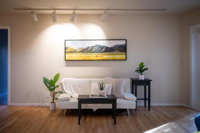 a view of a room with wooden floor and balcony