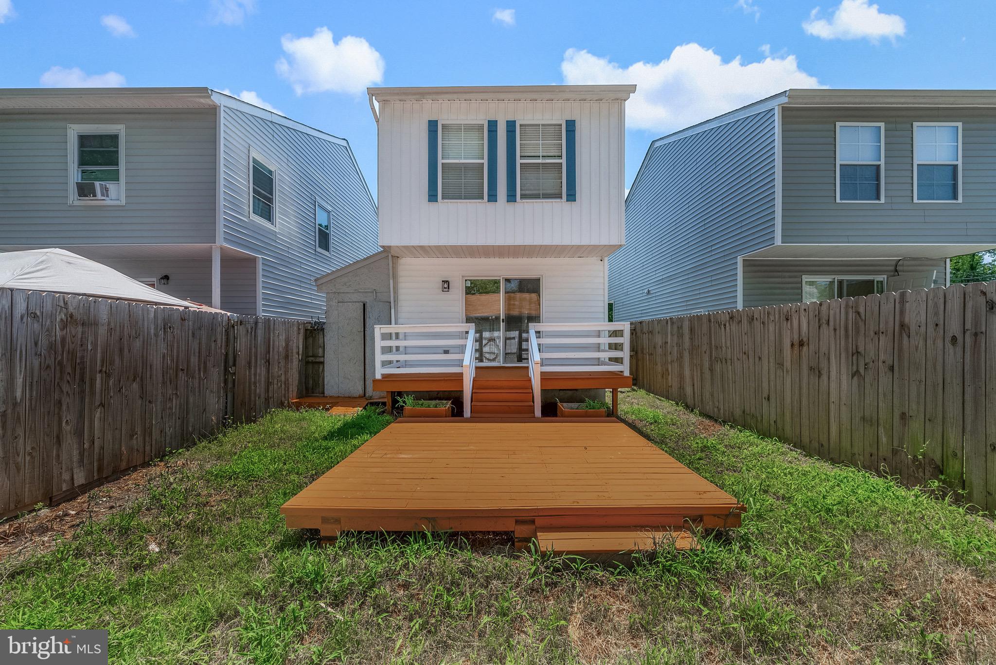 3403 Shell Road Hampton, VA 23661 - Photo 12 of 12 a view of a house with backyard and wooden fence