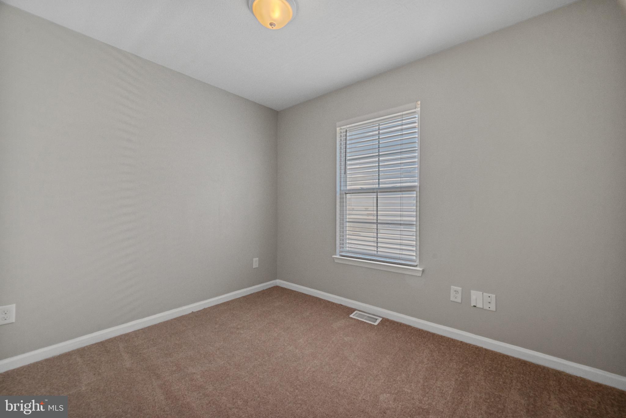 3403 Shell Road Hampton, VA 23661 - Photo 5 of 12 an empty room with a window