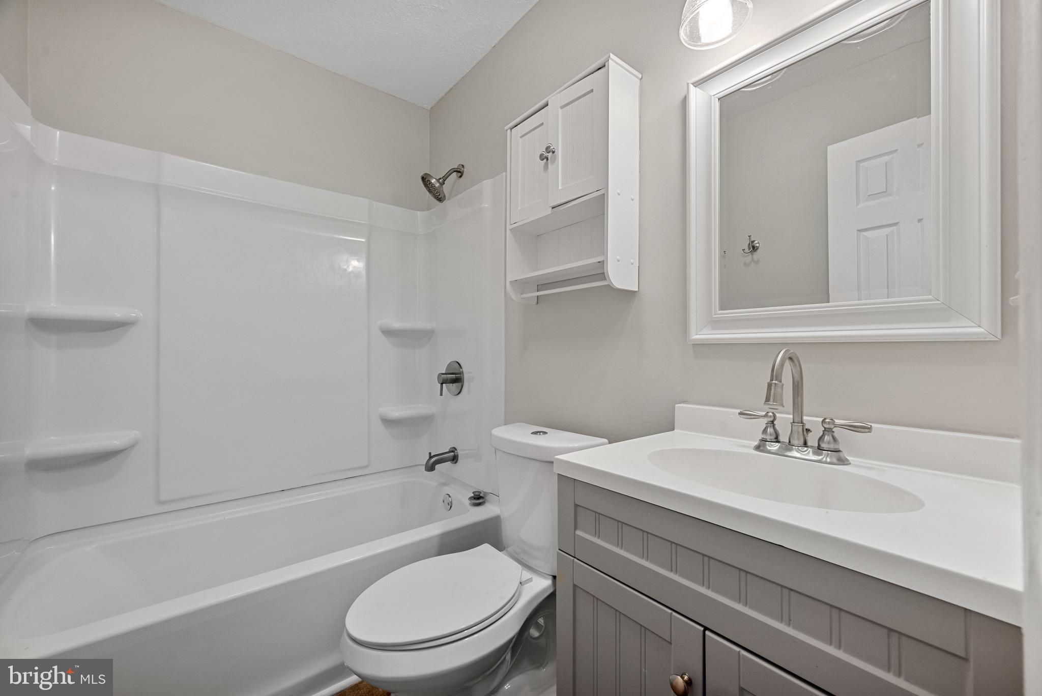 3403 Shell Road Hampton, VA 23661 - Photo 7 of 12 a bathroom with a sink toilet and shower