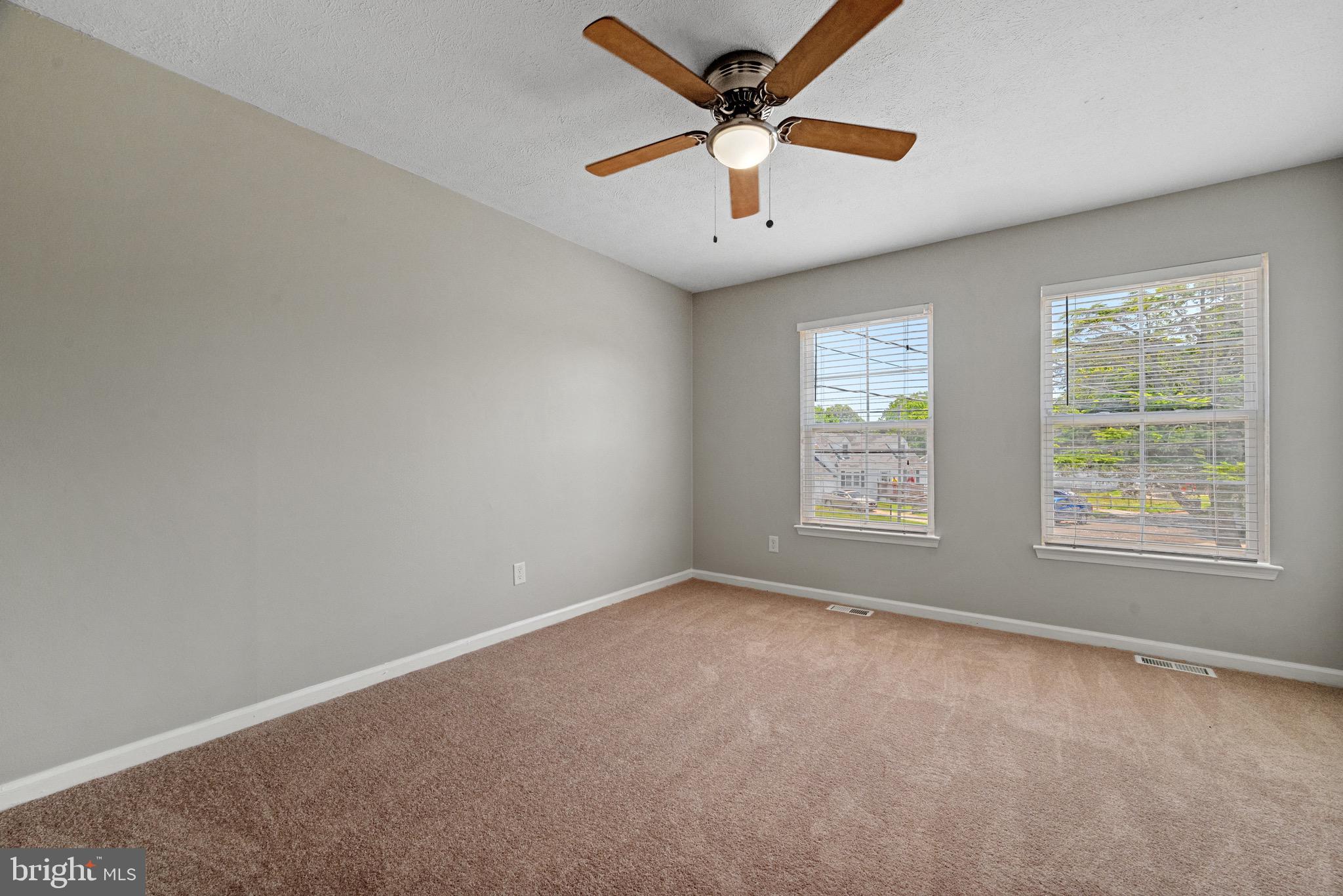 3403 Shell Road Hampton, VA 23661 - Photo 8 of 12 an empty room with windows and fan