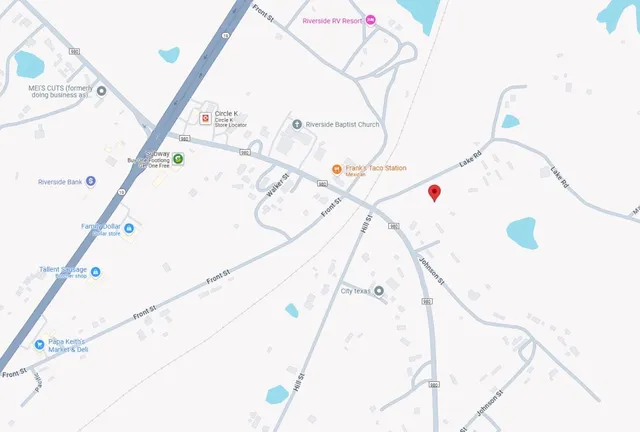 a white bath tub sitting next to a white walls