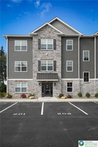 a front view of a house with yard