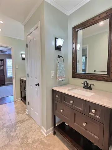 a bathroom with a double vanity sink and mirror
