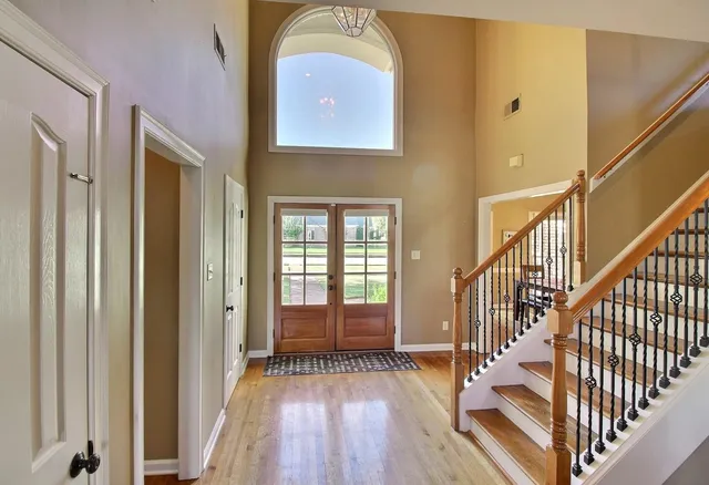 a view of front door with wooden floor