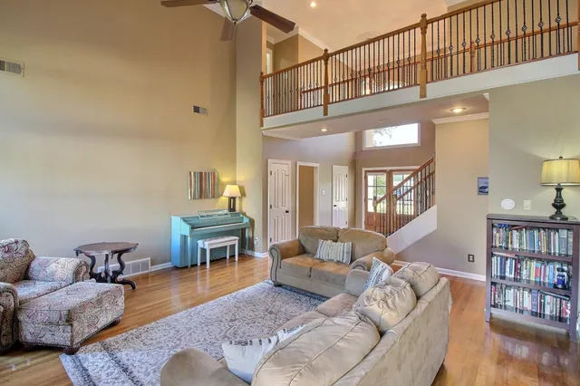 a living room with furniture and a table