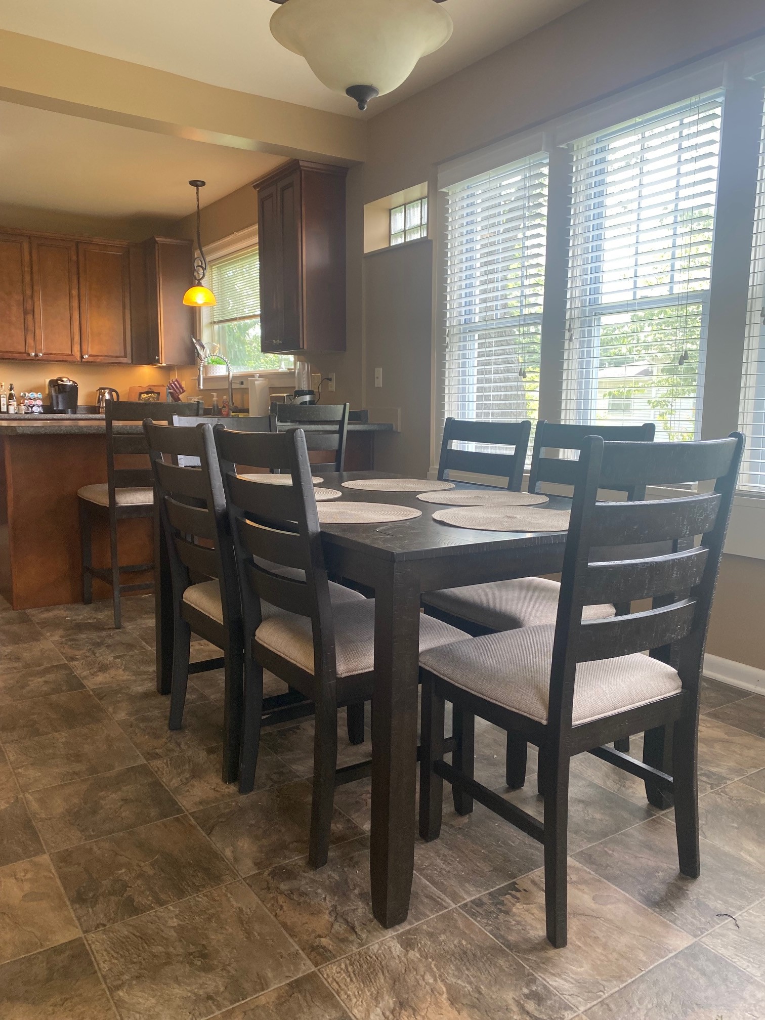 311 Main Street Martin, TN 38237 - Photo 15 of 49 a dining hall with stainless steel appliances granite countertop a table chairs sink and window