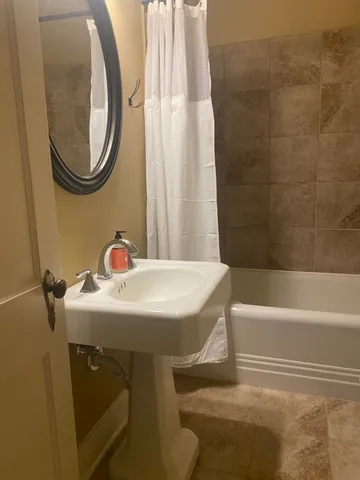 a bathroom with a sink a toilet and a bathtub