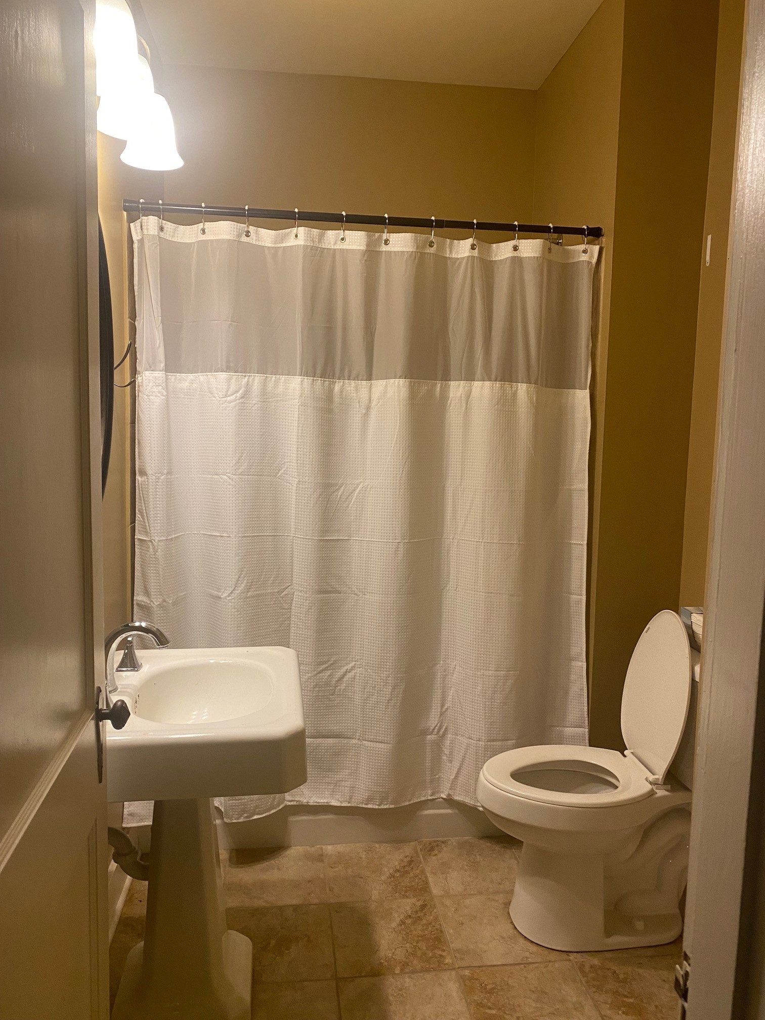 311 Main Street Martin, TN 38237 - Photo 27 of 49 a bathroom with a sink and a mirror