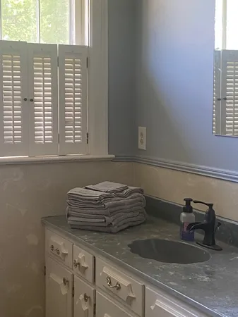 a bedroom with bed and window