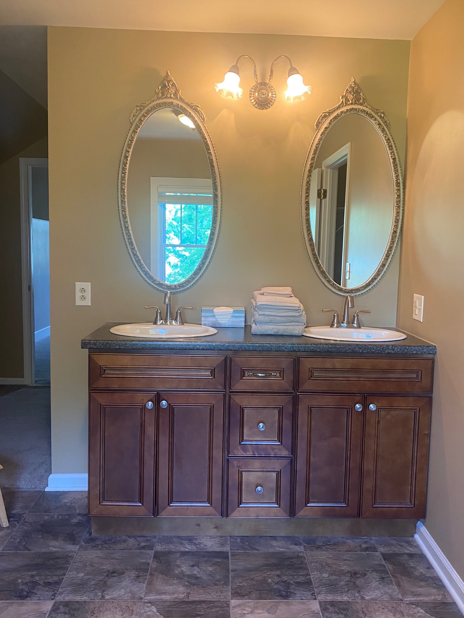 311 Main Street Martin, TN 38237 - Photo 43 of 49 a bathroom with a double vanity sink and a mirror