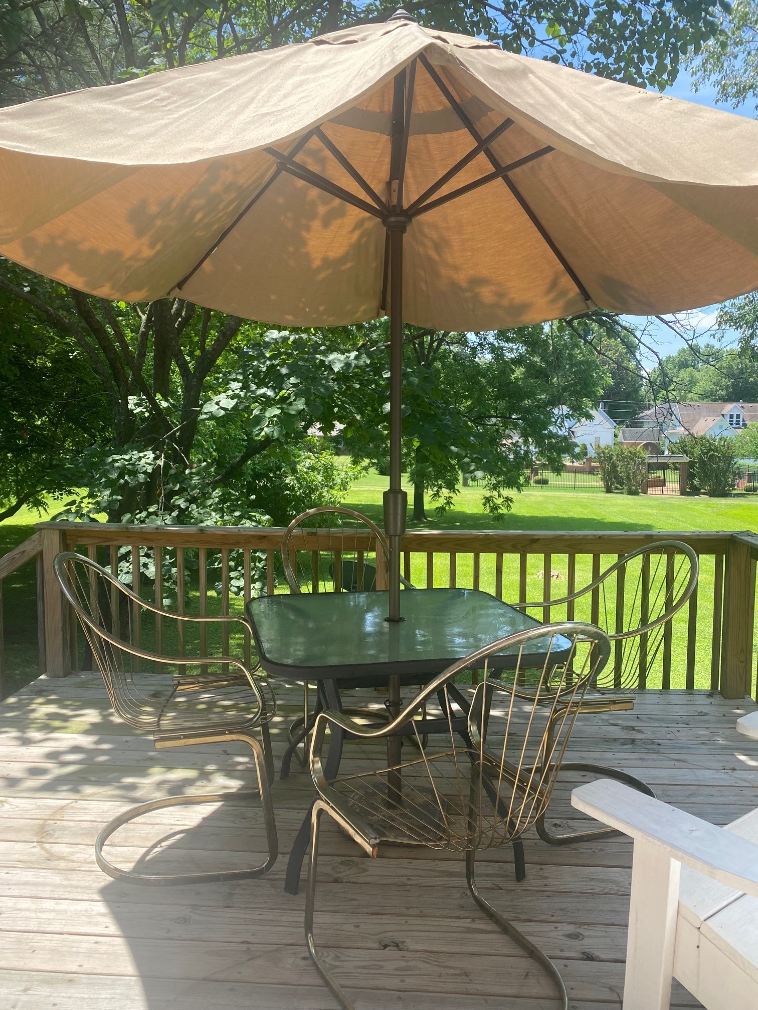 311 Main Street Martin, TN 38237 - Photo 7 of 49 a patio with glass top table and chairs