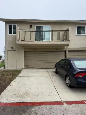 a view of a car parked in front of a house
