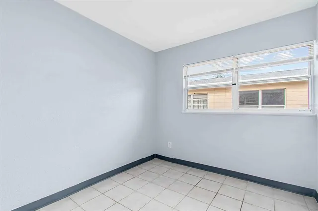 a view of an empty room with a window