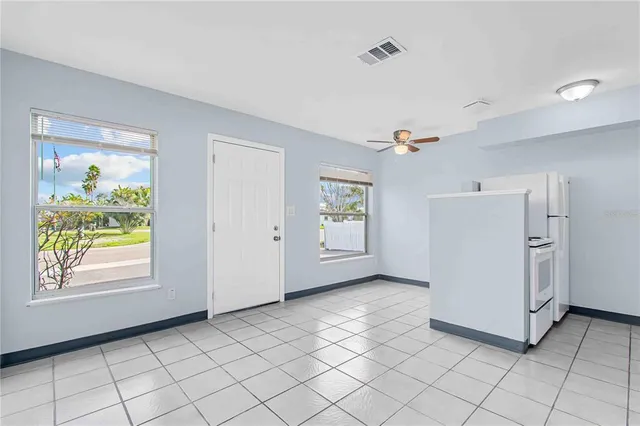 a view of a livingroom with an empty space and a window