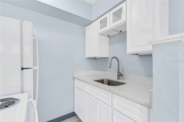 a close view of a sink and a vanity in the bathroom