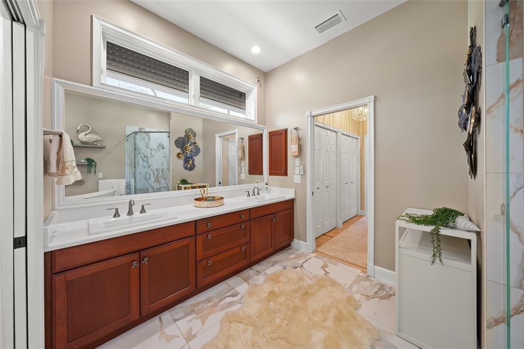 746 Eagle Point Drive Venice, FL 34285 - Photo 17 of 50 a spacious bathroom with a double vanity sink and a mirror