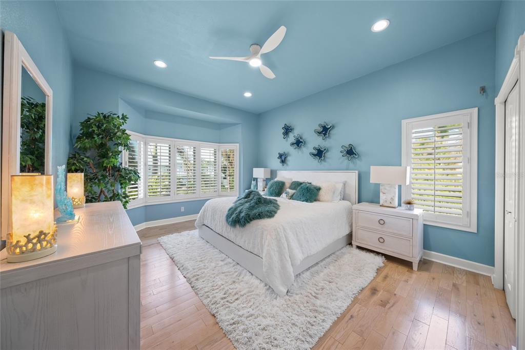 746 Eagle Point Drive Venice, FL 34285 - Photo 19 of 50 a spacious bedroom with a large bed and a large window