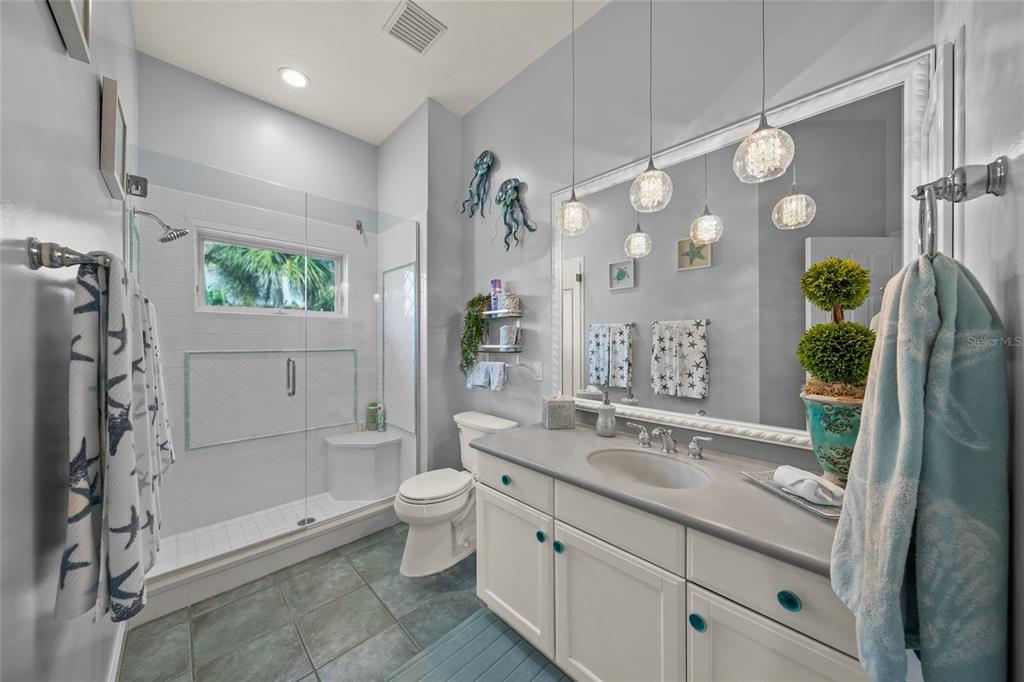 746 Eagle Point Drive Venice, FL 34285 - Photo 20 of 50 a bathroom with a double vanity sink toilet and shower