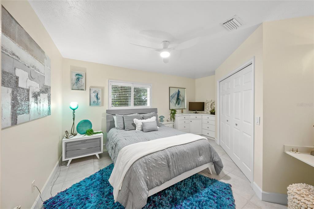 746 Eagle Point Drive Venice, FL 34285 - Photo 24 of 50 a bedroom with a bed and window