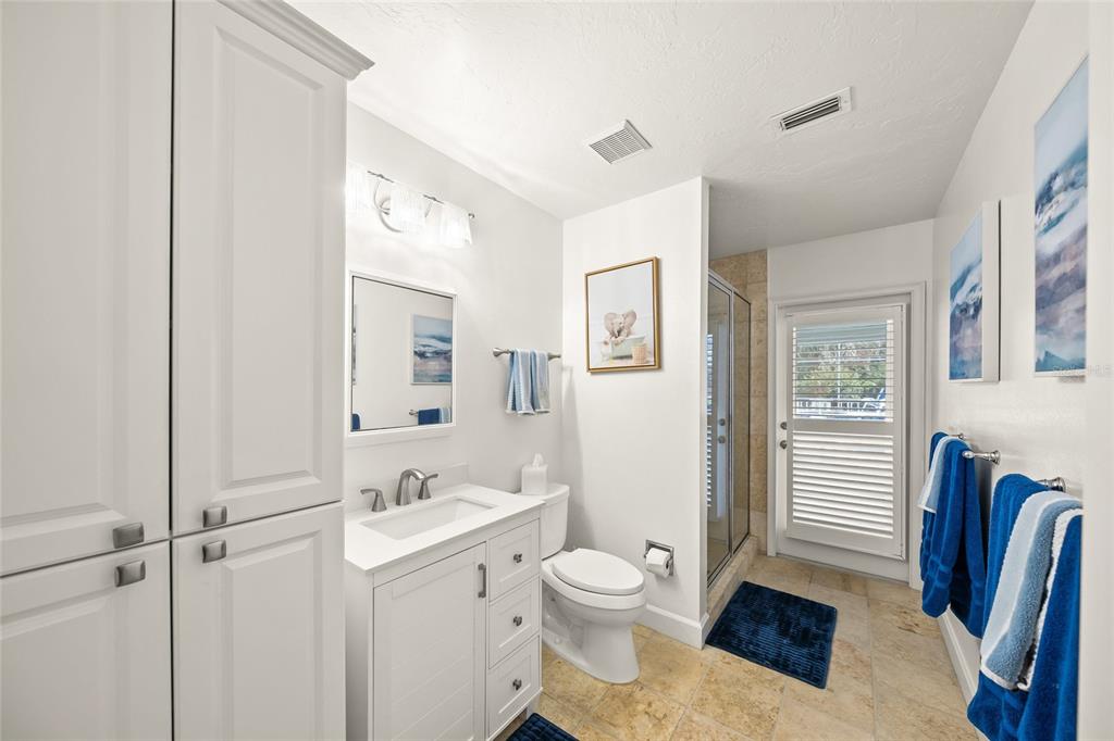 746 Eagle Point Drive Venice, FL 34285 - Photo 26 of 50 a bathroom with a sink a toilet and a mirror