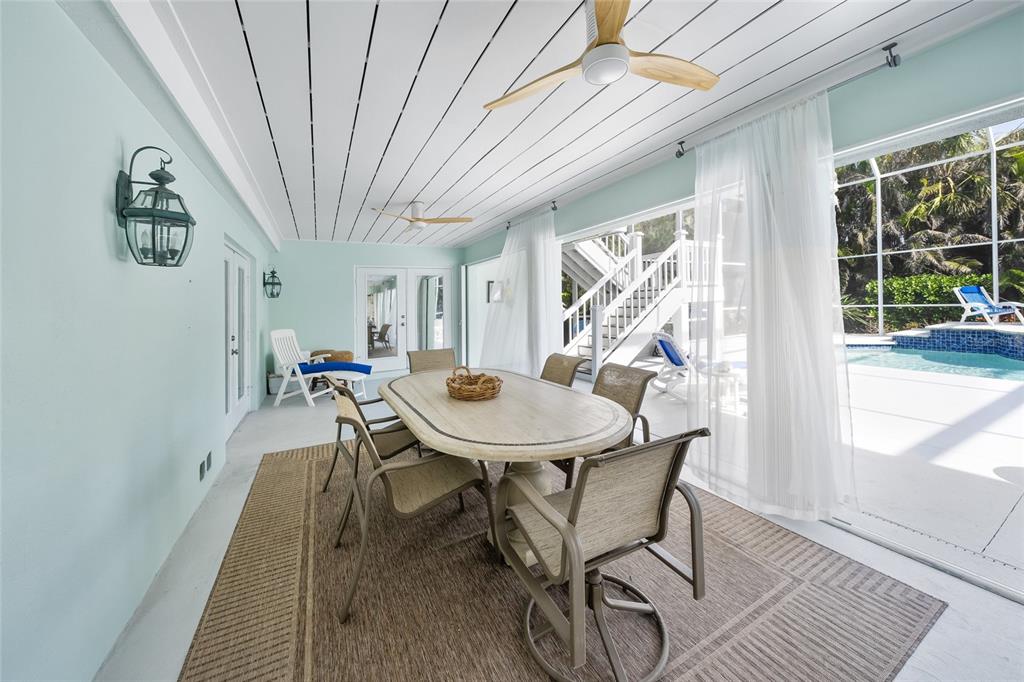 746 Eagle Point Drive Venice, FL 34285 - Photo 28 of 50 a view of a dining room with furniture window and wooden floor