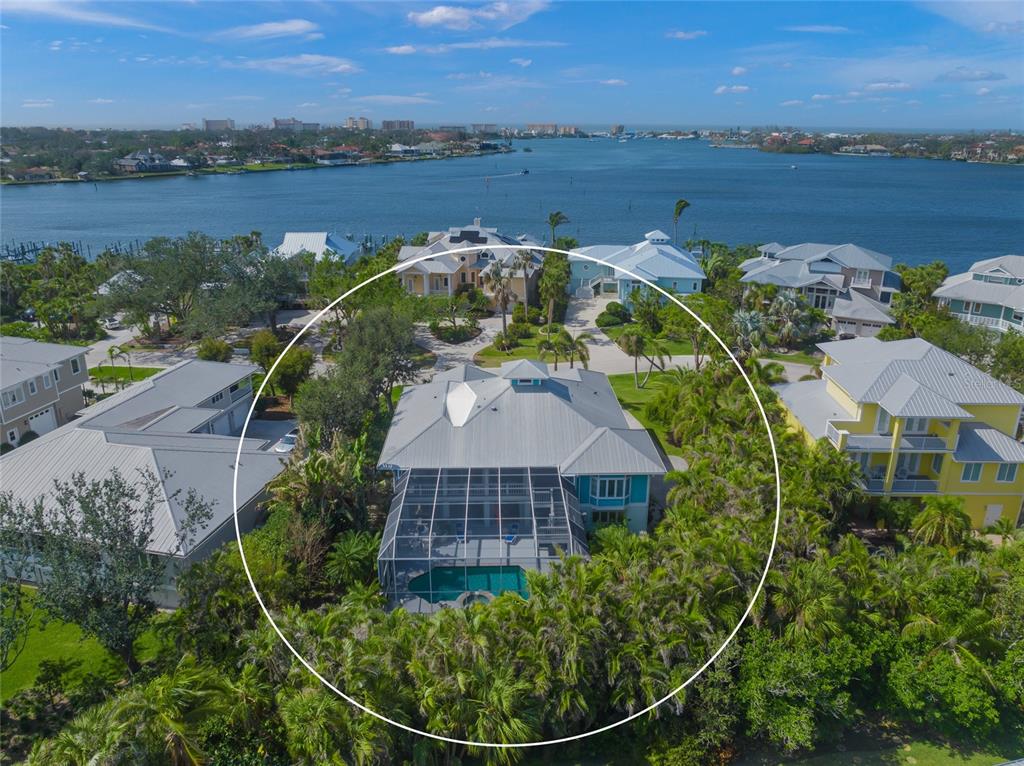746 Eagle Point Drive Venice, FL 34285 - Photo 37 of 50 an aerial view of a house with a garden and lake view
