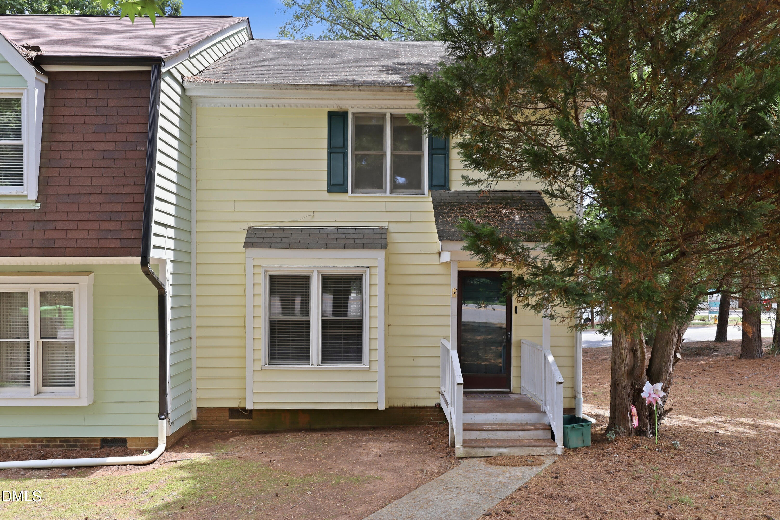 669 Bashford Road Raleigh, NC 27606 - Photo 2 of 19 a front view of a house with a tree