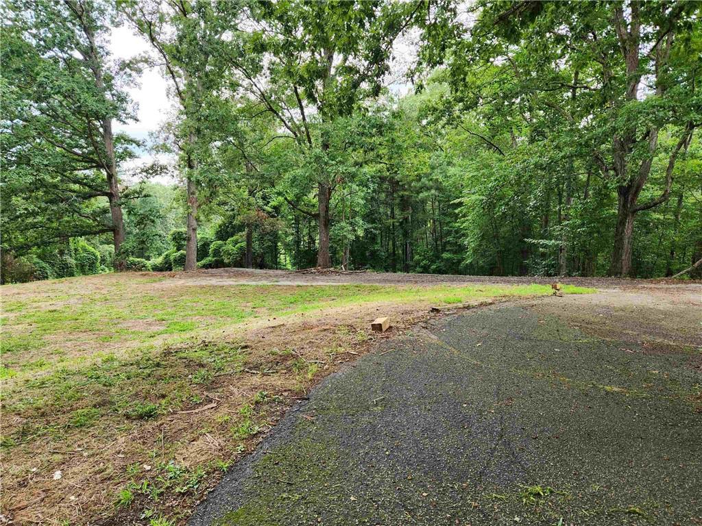 1397 McPherson Church Road Dallas, GA 30132 - Photo 2 of 9 a view of a swimming pool and a yard
