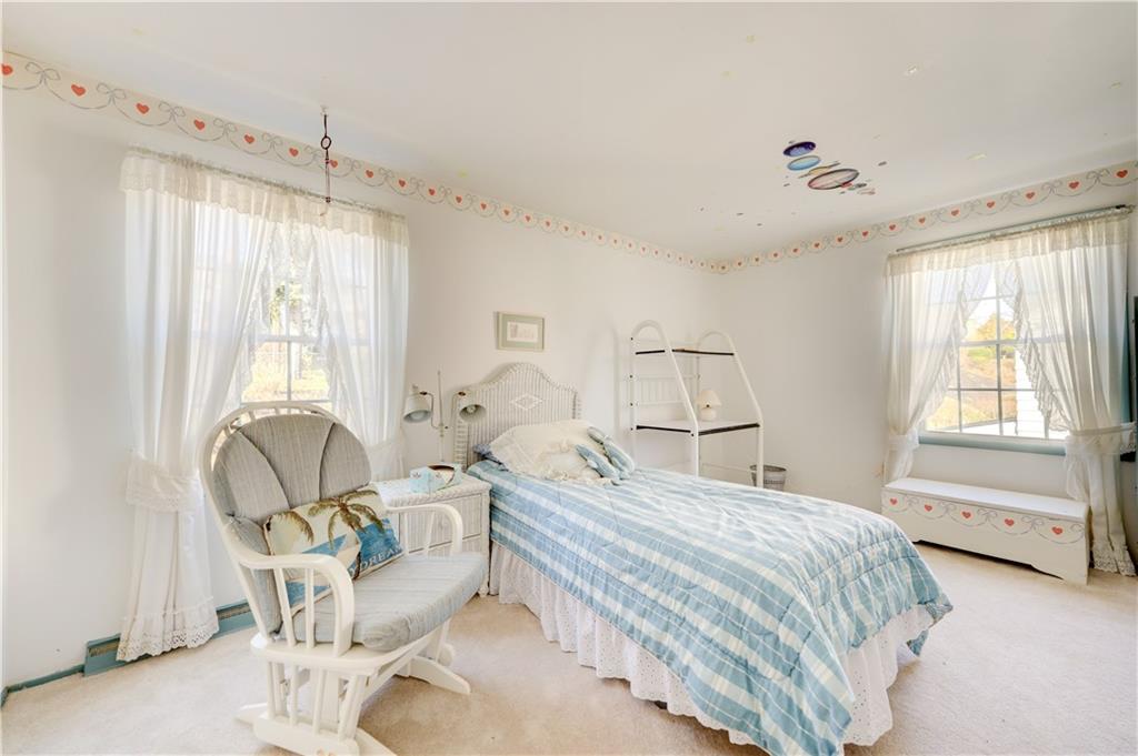 146 Morrison Drive Pittsburgh, PA 15216 - Photo 18 of 25 a bedroom with a bed a chair and next to a window