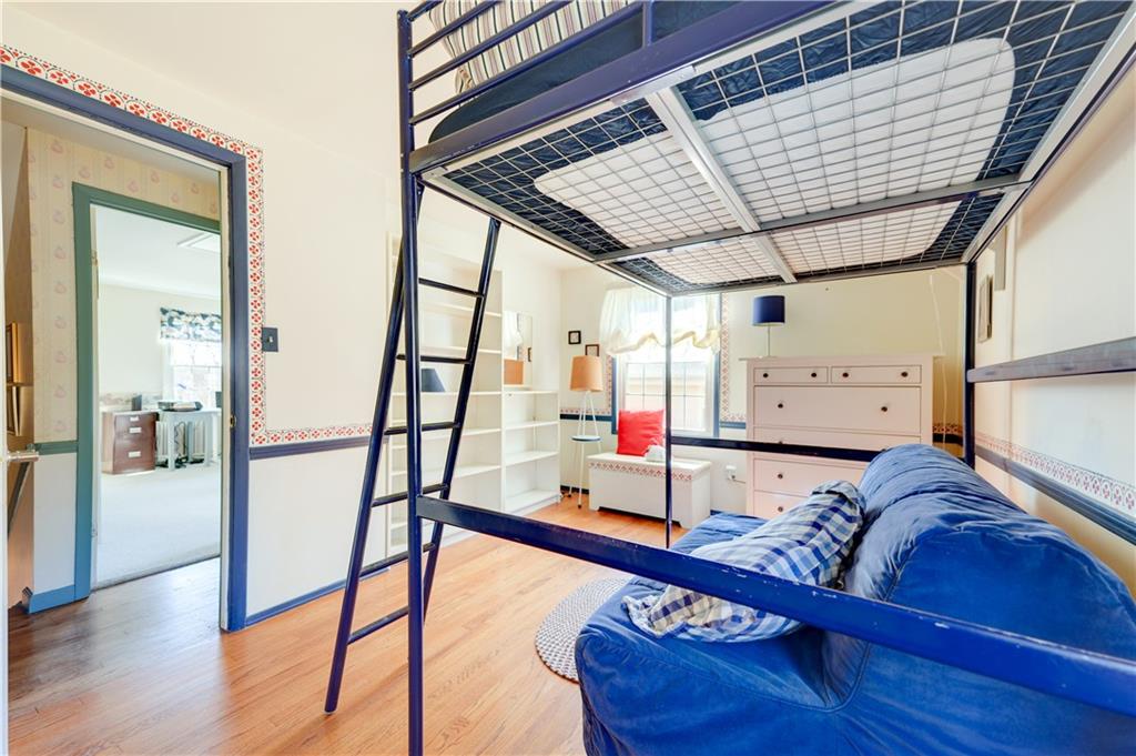 146 Morrison Drive Pittsburgh, PA 15216 - Photo 19 of 25 a living room with a bed and furniture with wooden floor