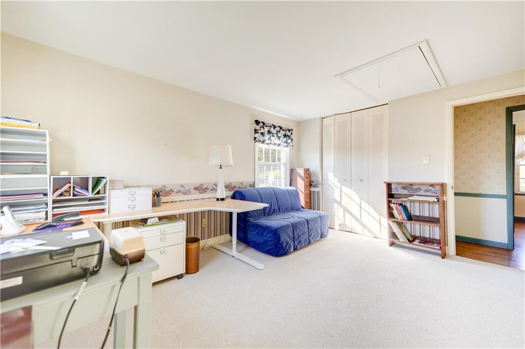 146 Morrison Drive Pittsburgh, PA 15216 - Photo 20 of 25 a room with a chair and white cabinets