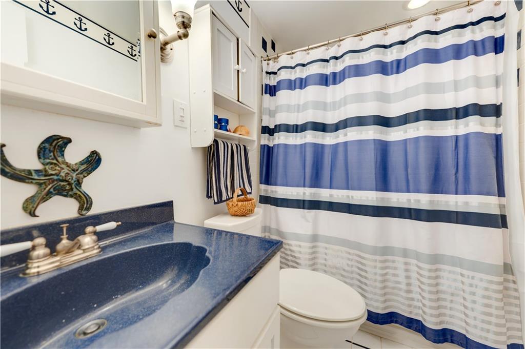 146 Morrison Drive Pittsburgh, PA 15216 - Photo 21 of 25 a bathroom with a sink a toilet and shower curtain