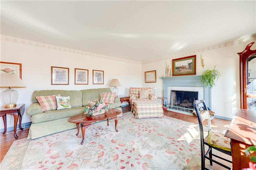 146 Morrison Drive Pittsburgh, PA 15216 - Photo 3 of 25 a living room with furniture a rug and a fireplace