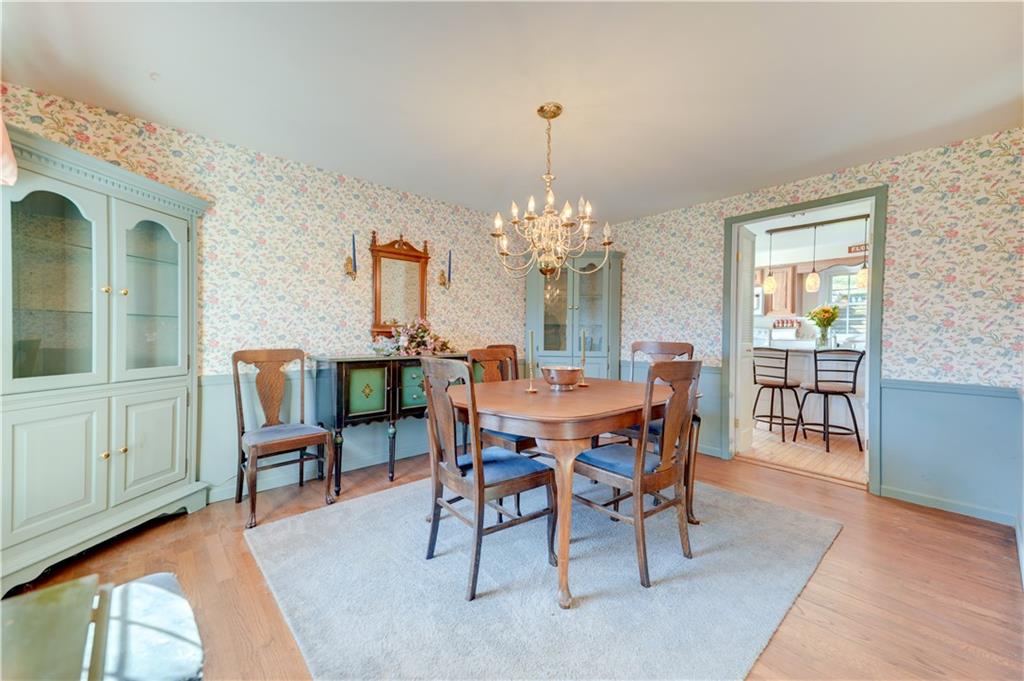 146 Morrison Drive Pittsburgh, PA 15216 - Photo 6 of 25 a dining room with furniture a chandelier and wooden floor
