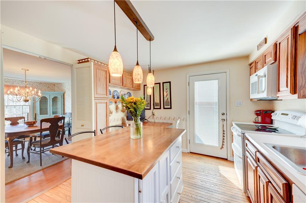 146 Morrison Drive Pittsburgh, PA 15216 - Photo 8 of 25 a kitchen with a table chairs and wooden floor
