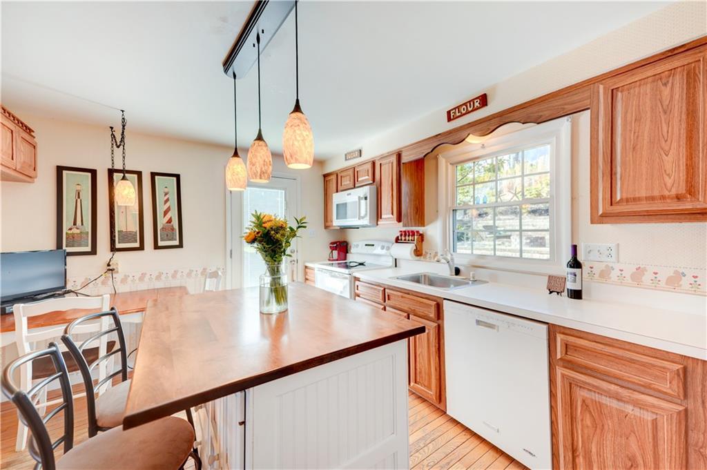 146 Morrison Drive Pittsburgh, PA 15216 - Photo 9 of 25 a kitchen with stainless steel appliances granite countertop a sink a stove and a refrigerator