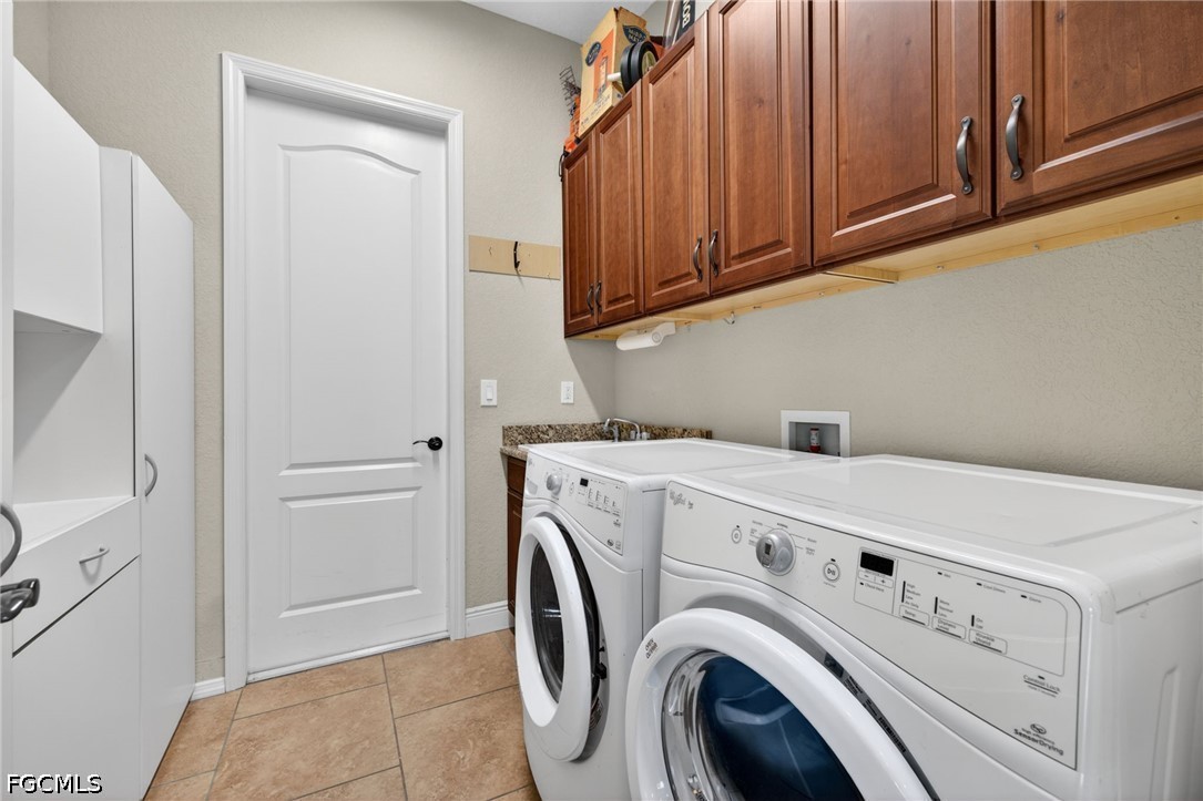 6109 Calusa Rdg Trail Bokeelia, FL 33922 - Photo 38 of 48 a utility room with dryer and washer