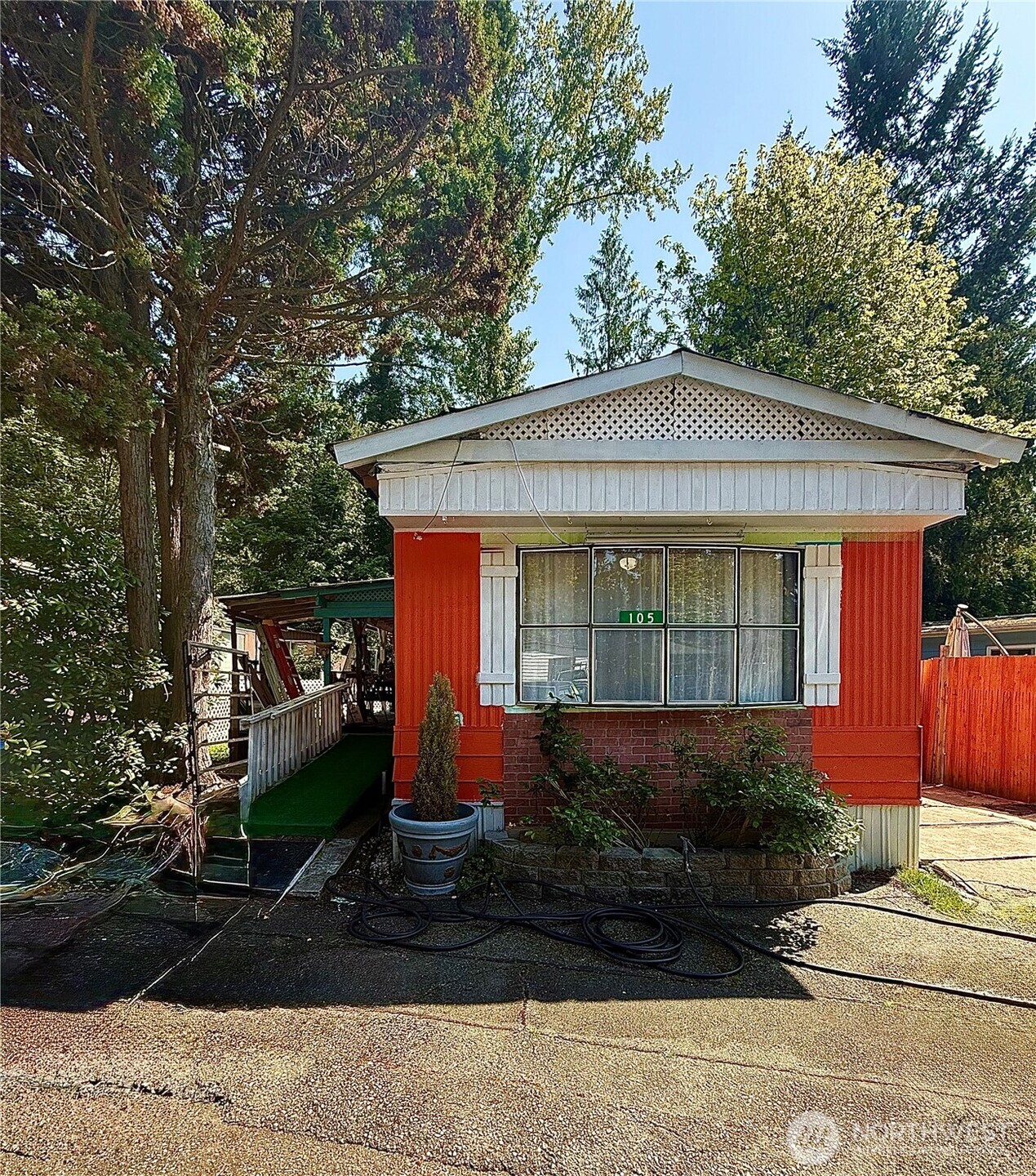 3333 228th Street Southeast, Unit 105 Bothell, WA 98021 - Photo 1 of 1 a front view of a house with garden