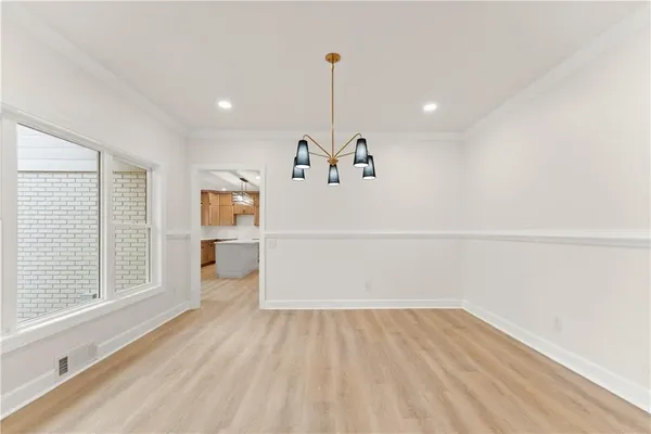 a view of a room with window wooden floor and windows