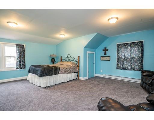 86 Hadley Street Springfield, MA 01118 - Photo 25 of 29 a bedroom with a bed and window
