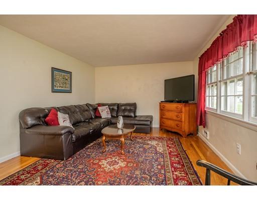 86 Hadley Street Springfield, MA 01118 - Photo 7 of 29 a living room with furniture and a flat screen tv