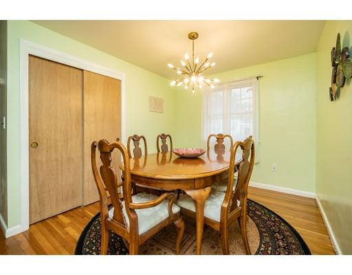 86 Hadley Street Springfield, MA 01118 - Photo 10 of 29 a view of a dining room with furniture and chandelier