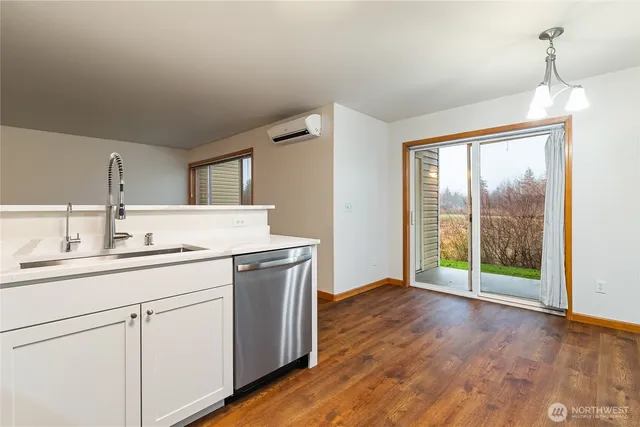 a bathroom with a double vanity sink and mirror