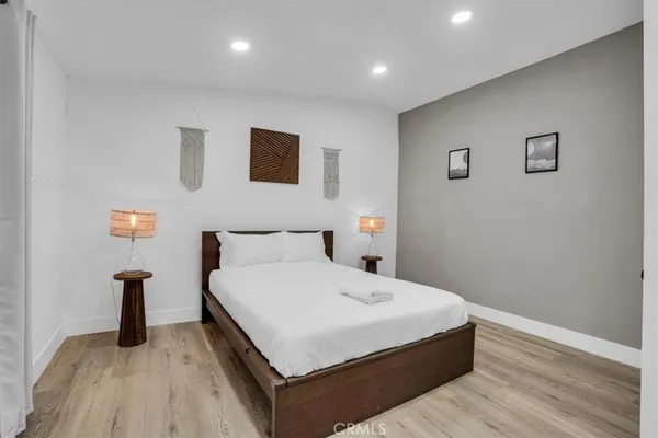 a large white bed in a white room