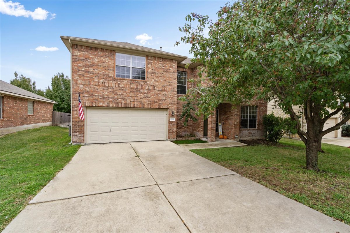 2338 Brookhollow Terrace Georgetown, TX 78626 - Photo 1 of 37 a front view of a house with a yard and a garage